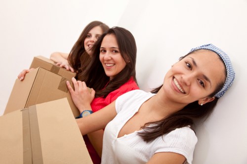 Movers transporting fragile belongings during a same day Mayfair removal