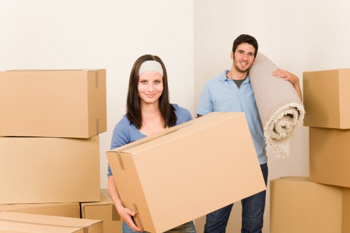 Moving boxes and furniture arranged for a removal service booking