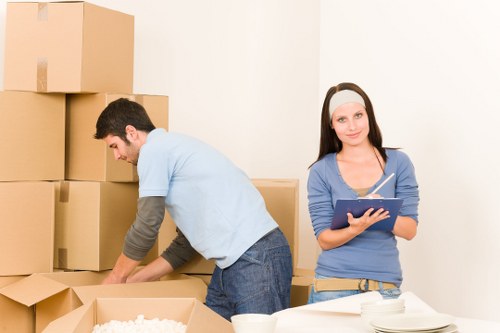 Furniture removal team collecting sofas and chairs in Mayfair