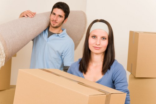 Careful wrapping of fragile household items during a Mayfair move